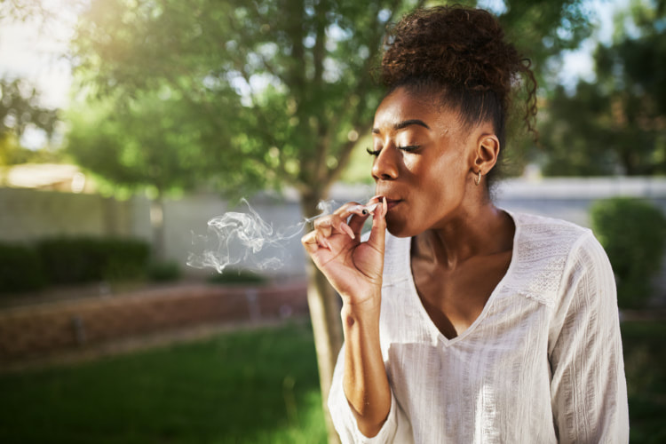 dosing cannabis woman smoking